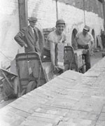 Felice Facchiano loading bricks, 1955