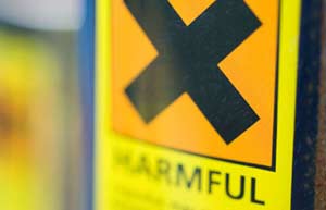 Using chemicals (Image: warning on chemical container)