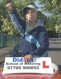 Joe Tracini as DK on top of a car