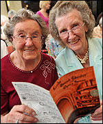 May Johnston and Joyce Pearson of STEP (Supporting the Elderly People) enjoy looking at old theatre programmes in the Emerald Grand Hall 