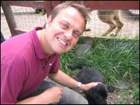 Jason Hardy petting a puppy