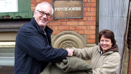 Eddie Butler presents a Euklisia rug to Newtown Textile Museum