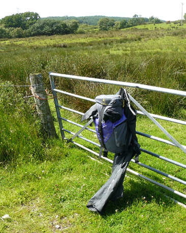Rucksack hanging on a gate