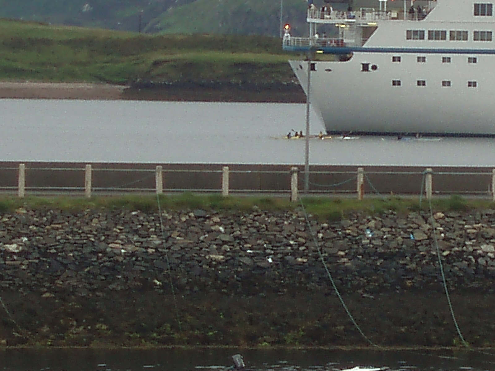 Canoeists under the stern of the boat