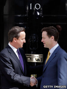 David Cameron and Nick Clegg outside the door of 10 Downing Street
