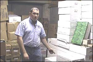 Tom Finnigan with boxes of books