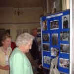 Dame Vera Lynn looking at a display of photos at the reunion of 93rd Searchlight Battalion at Larkhill, Wiltshire, 2005