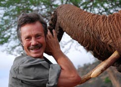 Jonathan Scott with orphaned elephant in Tsavo ©Toby Strong