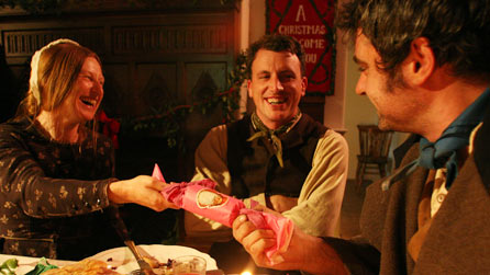 Man and woman pulling a cracker