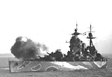 HMS 'Rodney' shells Caen prior to the attack, July 1944