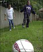 Boys practising their football skills