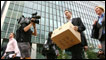 Man carrying a box from Lehman Brothers office