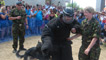 Rhod is caught by Oman, the RAF Police Dog. 