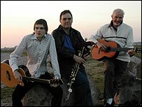 Band members pose on Walney beach