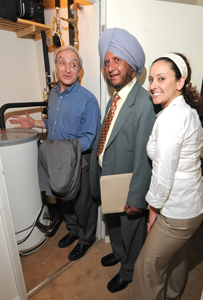 Cllr Rajwant Sidhu shows the CHP system