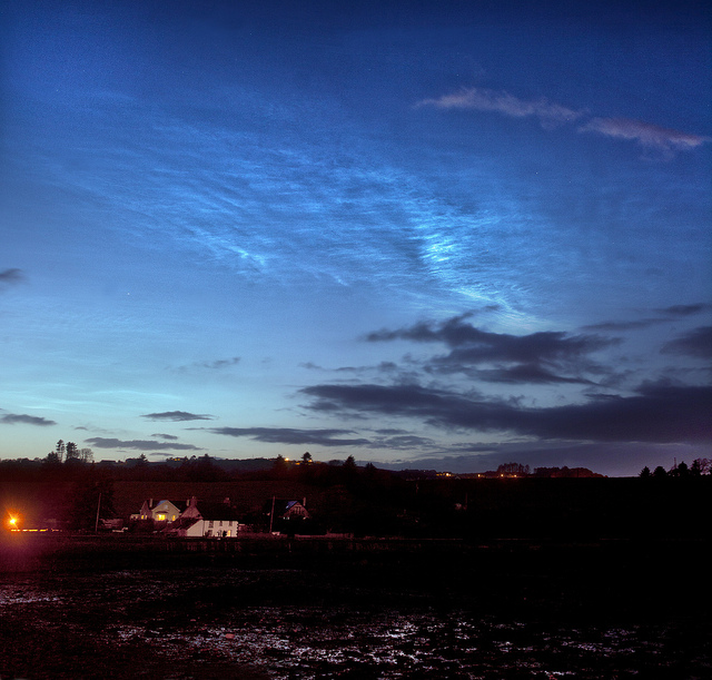 Noctilucent Clouds in the Wake of the Eclipse