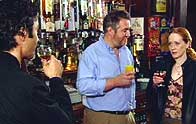 Lewis, Tommy and Eileen drink a toast