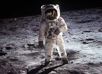 Astronaut Buzz Aldrin, lunar module pilot, walks on the surface of the Moon near the leg of the Lunar Module (LM) 
