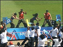The pitchside podium dancers entertain the crowd