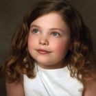 Angelic-looking 10-year-old girl wearing white