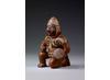 Pot in the form of a kneeling warrior from the Moche civilisation in Peru. Copyright Trustees of the British Museum