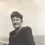 Mum wearing the scarf turban introduced by the Government for women in munition factories, to protect them from getting their long hair caught up in machinery.