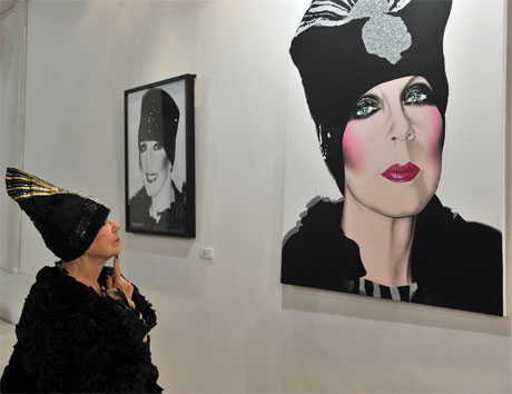 Molly Parkin looking at her portrait. Photo: BBC Cymru Wales/Mark Allen