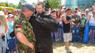 Rhod, in dog bite suit, is briefed by Flight Sergeant Arthur Sargeant.