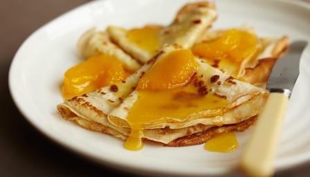 Crepes with orange butter sauce