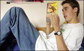 Teen reading a book