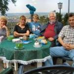 Peter today, second from the right surrounded by his family including one of his grandsons.