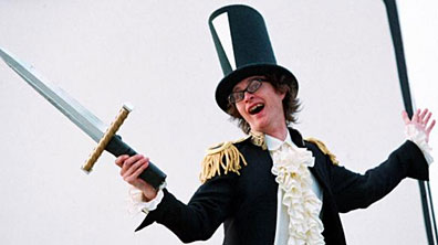 Simon Munnery as The League in Attention Scum