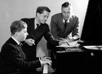 (Right) George R. Barnes, BBC Director of the Spoken Word, with Etienne Amyot at the piano and Leslie Stokes, in charge of presentation and publicity, BBC Third Programme.