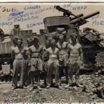 July 1943 - Bombardier Ward, Gunners Beaumont, Kearney, Jackson, Stewart, Sergeant Rodbard, Driver Morton of ‘A’ Troop, ‘A’ Battery 5 Don Sub Section on Catanina Plain, Adiano, Sicily. 105mm Howitzer on Grant chassis (USA) called Priest, the first self-propelled gun to be used by the British army.