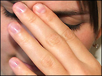 A woman with her head in her hands