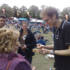 Steve signs a tambourine