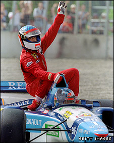 Jean Alesi gets a lift back to the pits from Michael Schumacher after the Frenchman took his only career F1 victory at the 1995 Canadian Grand Prix