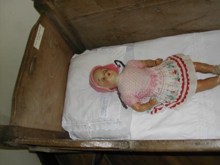 the small bed and the doll
