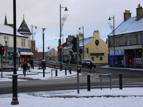 Colour view of Prestwick Cross in the snow.