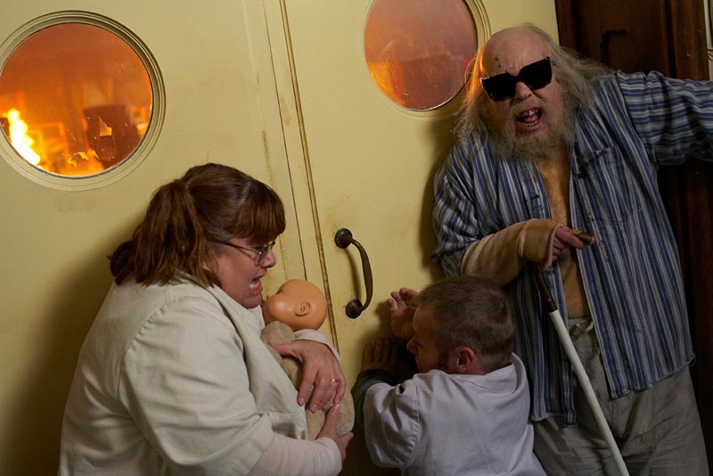 Robert, Joy and Lomax barricade the door.