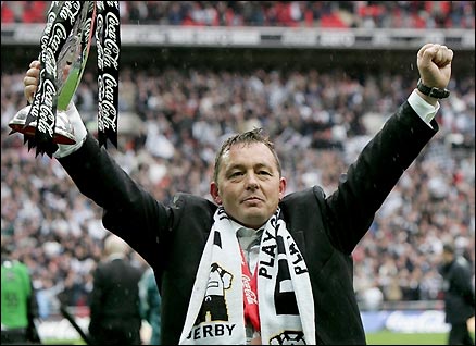 Billy Davies celebrates winning promotion with Derby