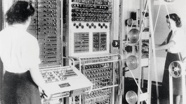 Wrens (members of the Women's Royal Naval Service) at Bletchley with Colossus, the world's first electronic programmable computer. 