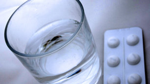 Pills and glass of water