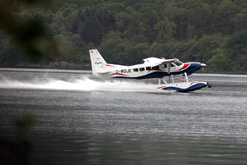 Cessna 208 seaplane taking off on Loch Lomond