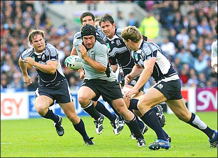 New Zealand's Ali Williams among the Scotland pack