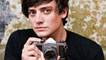 Aneurin Barnard holding a camera