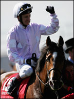 Martin Dwyer celebrates winning the Epsom Derby on Sir Percy.