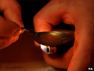 herion addict preparing to inject heroin