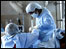 Doctors perform an operation with scant resources
