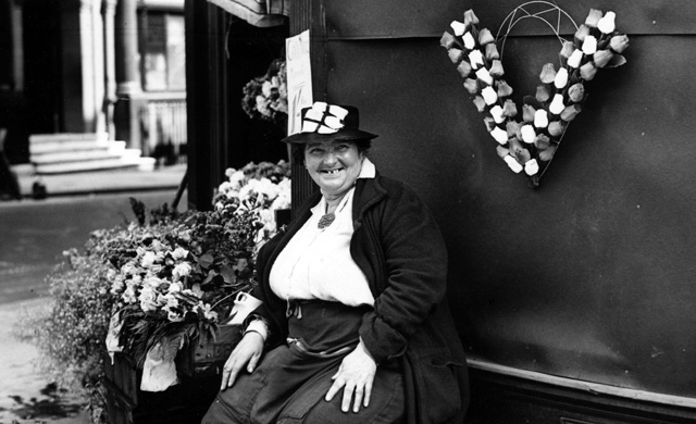 July 1941: A flower lady selling 'V' for Victory shaped arrangements at her stall on the Strand, in London (Photo: Getty Images)
